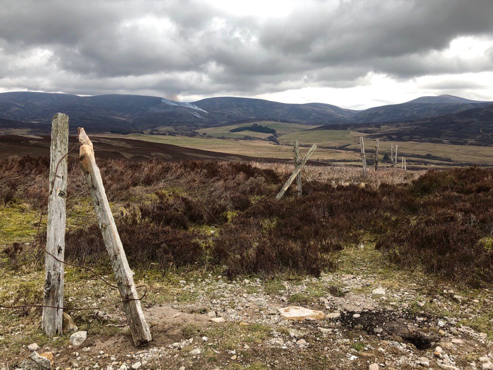Burning heather in the distance, looking back from Hill of Rowan